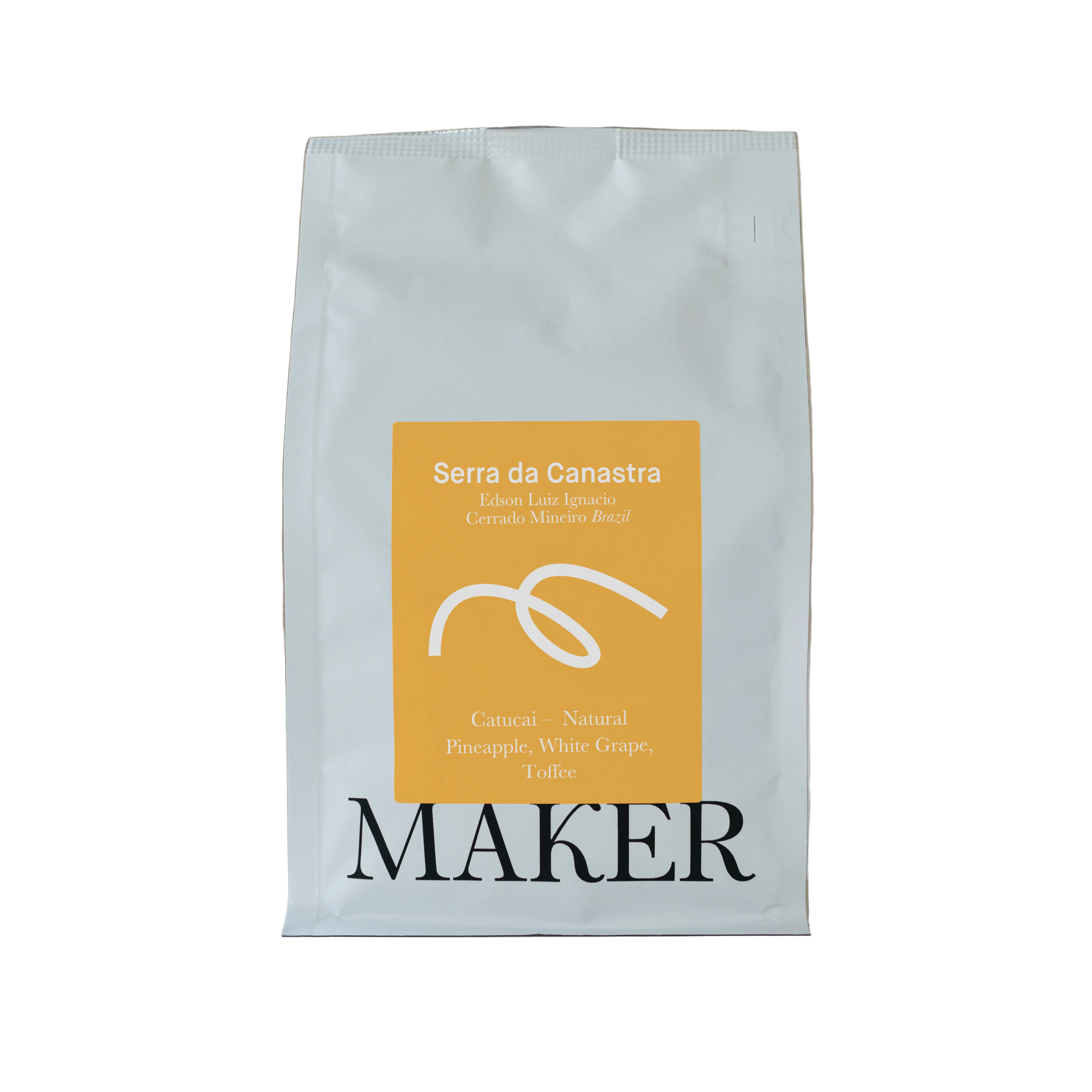 A pack of 'Serra da Canastra' natural espresso roast coffee beans, with the brand 'Maker' prominently displayed on the packaging.