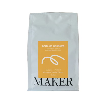 A pack of 'Serra da Canastra' natural espresso roast coffee beans, with the brand 'Maker' prominently displayed on the packaging.